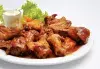 Куриные крылья в морковном соусе